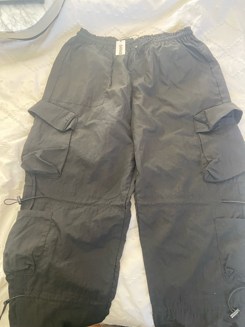 Garage Black Women’s Parachute Cargo Pants with Utility Pockets. Nylon material